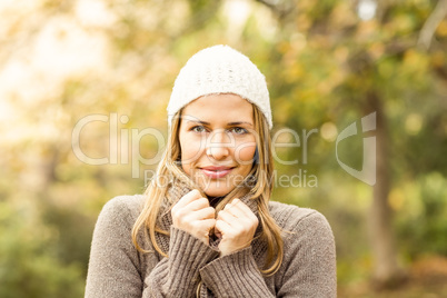 Portrait of smiling woman holding her scarf