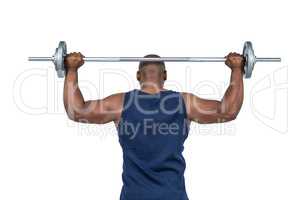 Fit man lifting heavy barbell