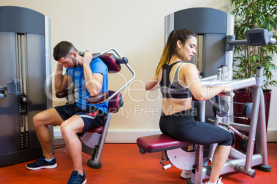 Fit man and woman working out