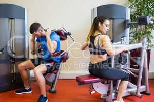 Fit man and woman working out