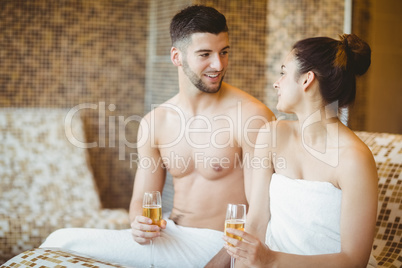 Romantic couple together with champagne glasses