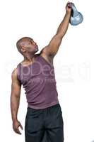 Fit man exercising with dumbbell