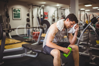 Fit man taking a break from working out