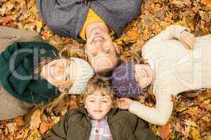Smiling young family doing a head circles