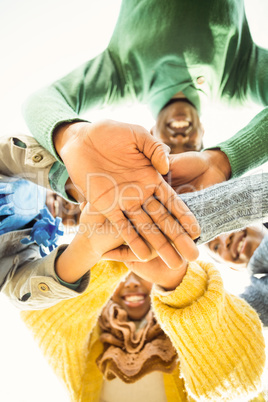 Young family doing a head circles and joining their hands