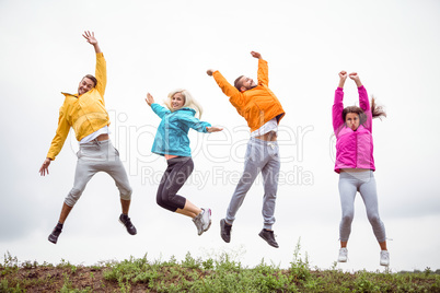 Friends jumping before a hike