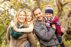 Smiling young family posing together