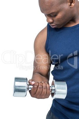 Muscular man exercising with dumbbell