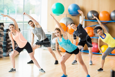 Fitness class exercising in the studio