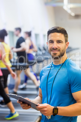 Handsome trainer smiling at camera