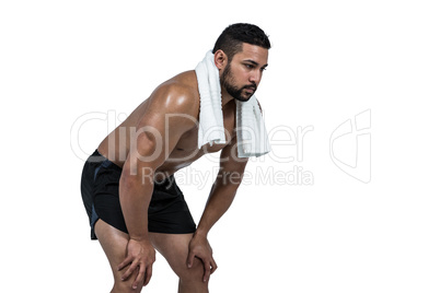 Muscular man with towel on shoulders