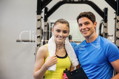 Trainer and woman discussing workout plan