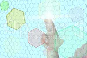 Hand before virtual wall with colored hexagons