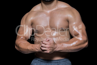 Mid section of a shirtless muscular man