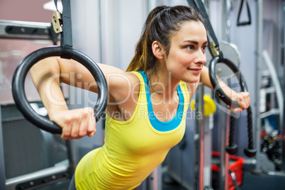 Smiling woman exercising her arms