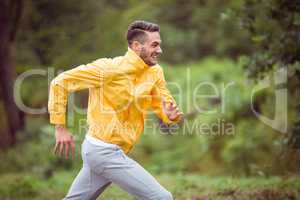 Happy man running on a hike