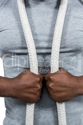 Fit man with battle rope