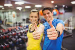 Fit couple smiling at camera