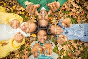 Young family doing a head circles and pointing the camera