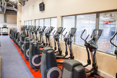 Collection of exercise bikes in a row