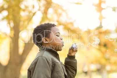 Little boy doing some bubbles