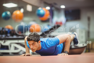 Fit man working out in studio Fit man working out in studio