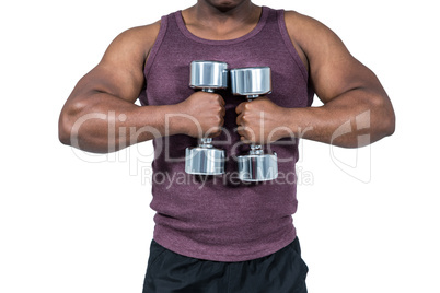 Fit man exercising with dumbbell