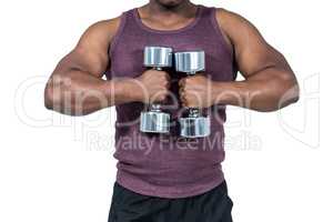 Fit man exercising with dumbbell