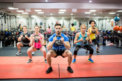 Fit people working out in fitness class