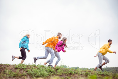 Friends jogging on a hike