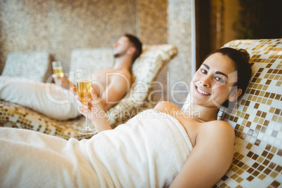 Man and woman holding glasses of champagne