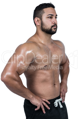 Muscular man flexing for camera