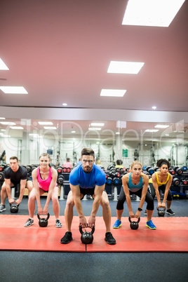 Fit people working out in fitness class