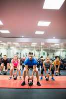 Fit people working out in fitness class