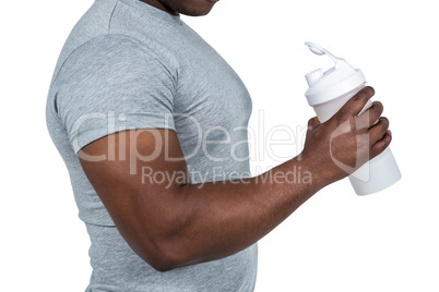 Fit man with protein shake
