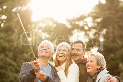 Smiling small family taking selfies