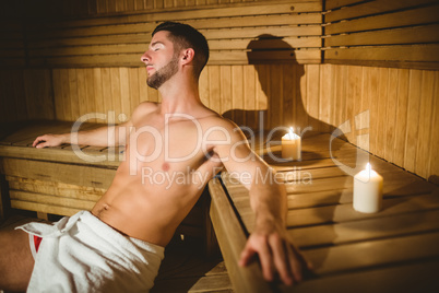 Man sitting inside a sauna