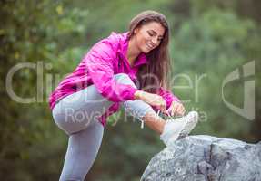 Fit woman tying her shoelace