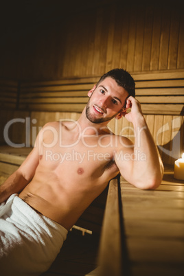 Man sitting inside a sauna