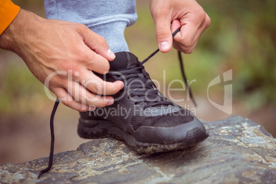 Man tying his shoe lace