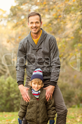 Happy father posing with his son