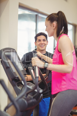 Fit woman working out with trainer