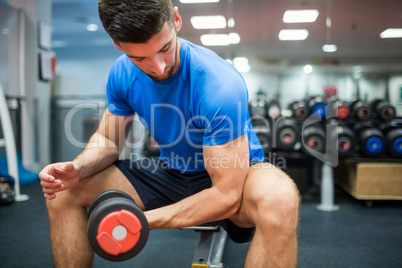 Close up of fit man working out with weights