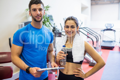 Trainer and athlete discussing workout plan