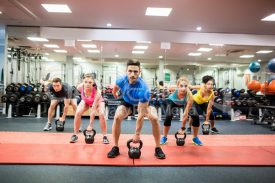 Fit people working out in fitness class