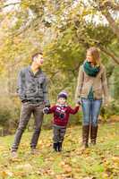 Smiling young couple with little boy laughing