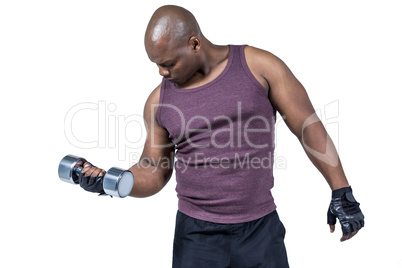 Fit man exercising with dumbbell