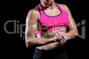 Muscular woman flexing her arm