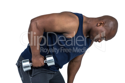 Fit man lifting heavy dumbbell