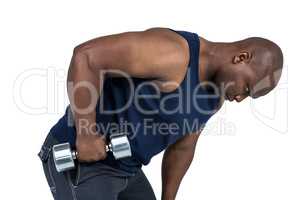 Fit man lifting heavy dumbbell